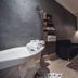 Ambre Epices Medina Riad in Marrakech spa room with bathtub, lounge seating, and arched bed niche