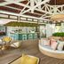 Paradise Cove Boutique Hotel in Cap Malheureux with open-air lounge, curved daybed, and tropical bar