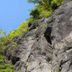 Yugawara Bay Mandarin House in Yugawara with a rocky cliff and green trees under a blue sky
