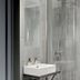 Boutique Hotel Hans Copenhagen bathroom with glass shower and wall-mounted sink