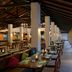 Habarana Village by Cinnamon in Habarana, open-air dining terrace with tables and chairs beside a pool