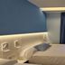 Hotel Cristina in Sorrento guest room with balcony view of the coastline and town