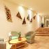 Riviera Maya Suites in Playa del Carmen lobby with seating, stairs, and colorful wall art