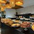 Breakfast buffet at Hotel Gogó da Ema in Maceió with pastries, cakes and coffee station
