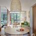 Crystalbrook Byron in Byron Bay: airy suite with dining area, lounge, and balcony view to greenery