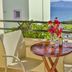 Haraki Mare Studios & Apartments in Rhodes balcony with table, chairs, flowers and sea view