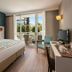 Titanic Deluxe Lara Antalya guest room with balcony, pool view, king bed and desk