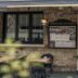 Logis -Hotel & Restaurant De La Place in Seulline, stone facade entrance with outdoor table and chairs