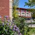 Residence & Conference Centre - Oakville exterior with landscaped garden and trees