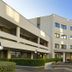 Park Hotel Mirabeau in Gasperina with a curved facade, entrance steps, and landscaped courtyard