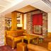 Premier Inn Huddersfield Central lounge bar area with leather seating, wood accents and brick pillars