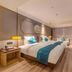 Fairyland Hotel - Kunming Nanping Pedestrian Street Store room with twin beds and seating area in Kunming