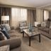 Hilton Washington DC/Rockville Executive Meeting Center suite living room with seating and dining area