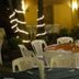 Hotel Mediterraneo Plaza in San Salvador outdoor patio dining area with tables and plastic chairs