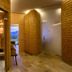 Vitalhotel Die Mittelburg in Oy-Mittelberg with a sauna-style interior, glass door, and mountain view