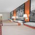 Super 8 by Wyndham Port Royal/Beaufort guest room with three beds and wall art