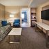 Hilton Garden Inn Toronto/Oakville Oakville guest room with sofa, TV, and seating area