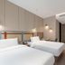 Motel Shanghai Liuzhou Road Guangda Convention And Exhibition Centre room with two twin beds in Shanghai