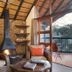 Tshukudu Bush Lodge in Pilanesberg lounge with fireplace and deck seating