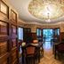 Hotel Boutique Villa Elisa in Arequipa: ornate dining room with floral ceiling mural and wood paneling