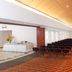 Hotel Estelar de La Feria Bogotá conference hall with rows of chairs and buffet table