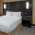 Residence Inn by Marriott Greenville-Spartanburg Airport guest room with king bed and window view in Greenville