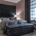 Boutique Hotel Yöpuu room in Jyväskylä with tufted headboard, bedside lamps and dark bench