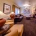 Feather Falls Casino & Lodge in Oroville living room with sofa, fireplace, desk and seating area