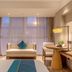 Fairyland Hotel - Kunming Nanping Pedestrian Street Store room with sofa, desk, and large window in Kunming