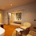 Montebelo Viseu Congress Hotel in Viseu: spa suite with soaking tub, lounge chairs and bedroom alcove