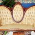 Lost Bayou Guesthouse Galveston vintage tufted loveseat with carved wood frame