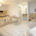 Bourbon Vitoria Residence Hotel in Vitória: studio room with bed, sofa, kitchenette and dining area