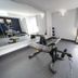 Comfort Inn & Suites Wyomissing/Reading fitness room with weight bench, dumbbells and window view in Wyomissing