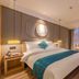 Fairyland Hotel - Kunming Nanping Pedestrian Street Store guest room with double bed and seating area in Kunming
