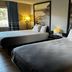 Super 8 by Wyndham Estherville room with two beds, bedside lamps, and a window view