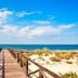 Sol Sancti Petri in Chiclana de la Frontera features a wooden boardwalk to a sandy beach and sea