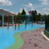 Villas at Seven Dwarfs Lane Resort Kissimmee splash pad with water features and poolside seating