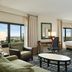 Hilton Orlando Lake Buena Vista - Disney Springs Area room with two beds, desk, and city view