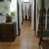 Some Days Of Silence Resort And Spa in Dong Hai: tiled hallway with white curtains and staircase