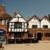 The White Swan Hotel in Stratford-upon-Avon, Tudor-style exterior with outdoor seating and pedestrians