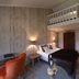 Boutique Hotel Slenaker Vallei in Slenaken: loft room with mezzanine bed, sofa, and TV