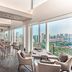 Shangri-La Singapore dining area with floor-to-ceiling windows and city skyline views