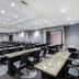 Hampton Inn & Suites Raleigh-Durham Airport-Brier Creek meeting room in Raleigh with rows of conference tables and chairs