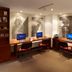 Hotel Estelar de La Feria Bogotá business center with computer workstations and wall art