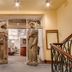 Malopolanka & Spa in Krynica-Zdrój entrance with two stone statues framing the doorway