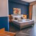 Apollo Resort Art Hotel in Kyparissía guest room with king bed and balcony sea view