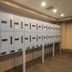 Toyoko Inn Koriyama in Kōriyama: wall of numbered parcel lockers in a hotel hallway