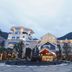Hakka Park International Hotel in Meizhou, exterior courtyard and illuminated hotel facade at dusk