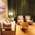 Clovelly Garden Hotel Shanghai lounge with sofa, armchairs, floor lamp and round coffee table