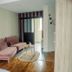Logis -Hotel & Restaurant De La Place in Seulline: stylish lounge with pink sectional sofa and wood floors